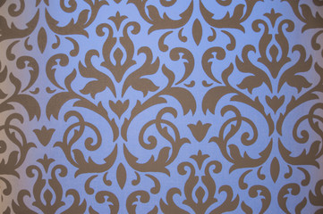 Texture of a dense fabric with an ornament.