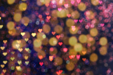 Blurred view of beautiful lights on black background. Party atmosphere