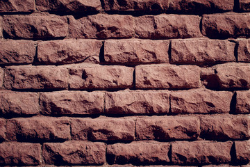 maroon brick wall close up