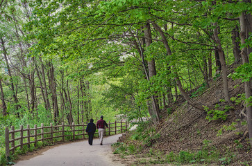 Fototapeta premium Healthy lifestyle - couple walking in the public park
