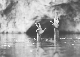 hands in water, drowning concept