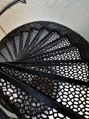 Black wrought iron circular stairs inside a lighthouse