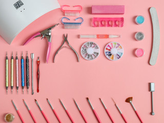 Manicure equipment on a pink background
