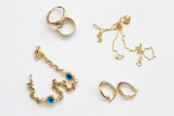 gold jewelry on white background