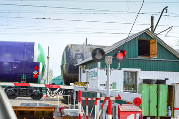 MOSCOW REGION, RUSSIA - The electric train ED4M DC-0456 approaching a railway crossing