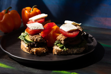 Lunch with bread avocado, onion, tomato, cheese and hamburger