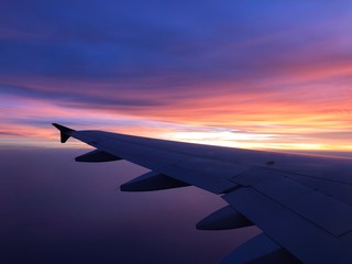 Naklejka na ściany i meble Photo of the sunset from plane.