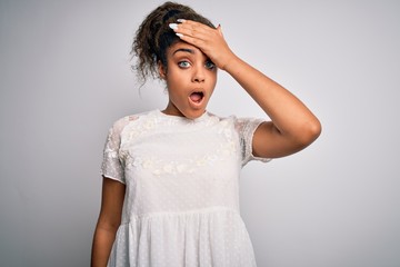 Young beautiful african american girl wearing casual t-shirt standing over white background...