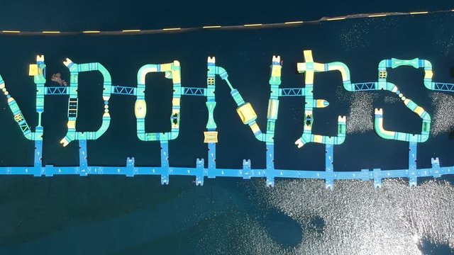 flying high up over the huge inscription indonesia Aqua Dreamland Bali in sunny weather Gilimanuk Melaya west bali indonesia
