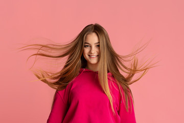 Fototapeta premium Portrait of teenager girl with flying hair