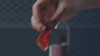 cook beautifully lays slices of planed wild boar
chef wild boar
decorates the dish
hands put on a plate
close-up 4.6K