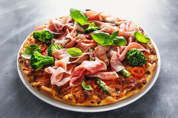 Italian classic pizza with meat and broccoli