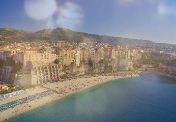 Fototapeta premium Tropea, Calabria. Amazing aerial view of touristic souther italian town in summer season from flying drone
