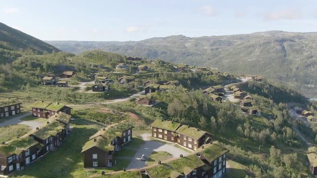 Typical norwegian houses with grass on the roof at Haukelifjell Skisenter