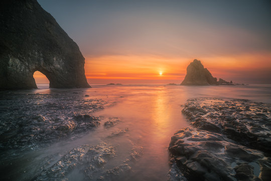 Wide angle photograph of a winter sunset at coastal Olympic National Park
