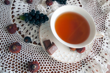 Still life with a cup of tea on a beautiful napkin