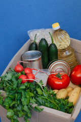 Donation box with food on a blue background