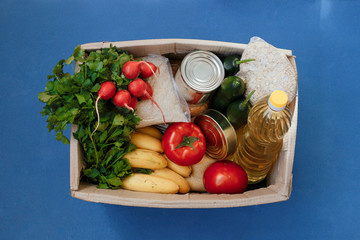 Donation box with food on a blue background