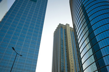Low angle view of glass and steel building facade of modern office buildings. High rise skyscrapers in Buenos Aires, Argentina.