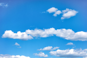 Obraz na płótnie Canvas Bright blue cloudy sky on summer day.