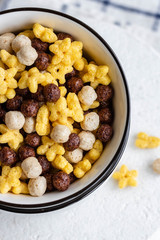 Assorted breakfast cereals: chocolate balls and honey stars