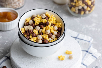 Assorted breakfast cereals: chocolate balls and honey stars