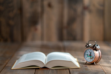 Sports improve the body, books improve the brain, stay home do sports read books, books and dumbbells on wooden floors