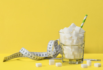 Sugar cubes measuring tape Weight control diet detox concept