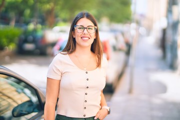 Young beautiful woman smiling happy and confident. Standing with smile on face at the town street