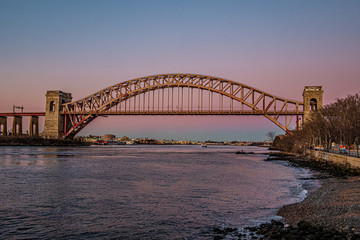 hell gate bridge at sunset