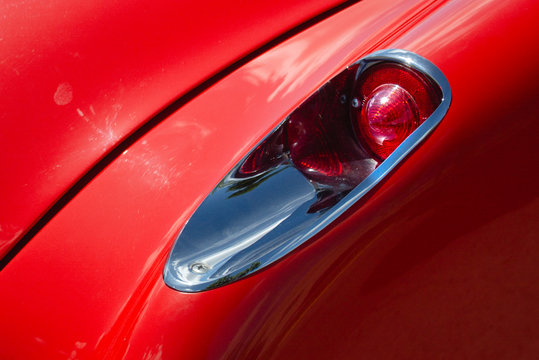 Miami, Year 2019: Classic 50s Chevrolet Corvette taillight. Chrome lamp, shiny body os american muscle car
