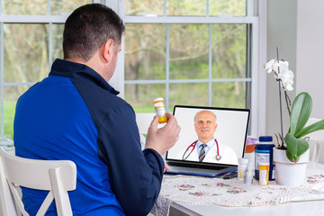 Sick Patient talking to a doctor online through a laptop