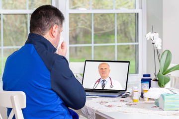 Patient talking to a doctor online through a laptop