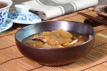 Braised Fish Maw in Red Gravy, famous Hakka cuisine in China, Hong Kong, Taiwan, Thailand. In Chinese food culture, fish maw is a type of food that promotes longevity or wondrous health benefits.