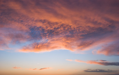 Fototapeta na wymiar Vibrantly lit up clouds during sunset