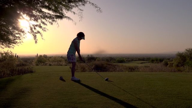 Woman Golfer on the Driving a Golf Ball