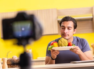 Young man blogging about food supplements