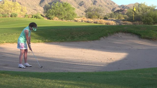 Woman Golfer in a Sand Trap