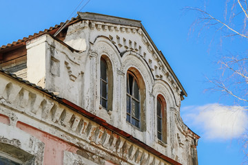 Fototapeta premium Old abandoned building of the 18th century. Facade of an ancient house.