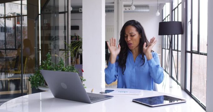 Happy accomplished female executive manager received approved information about goal with startup rejoicing in company office interior, slow motion of prosperous African American business woman

