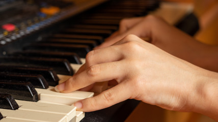 Fototapeta premium A hands playing with a piano