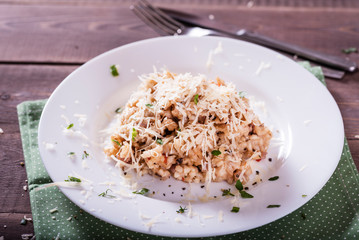 risotto with mushrooms, fresh herbs and parmesan cheese. Tasty and healthy vegetarian lunch
