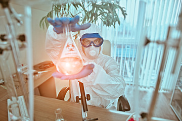 doctor shows a flask