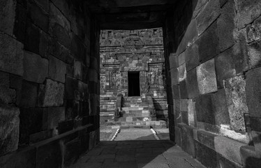 Stone corridor, tunnel in ancient temple Plaosan in Java island, Indonesia