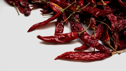 red chillies gathering on white background