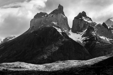 Black and white landscape of the Cuernos del Paine mountain peaks with vintage atmosphere, Torres del Paine national park, Patagonia, Chile.