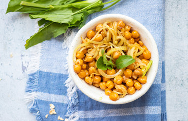 Cooked chickpea beans with fried onion. Vegan healthy food.