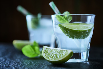 Gin and Tonic on black stone background. Close up.	