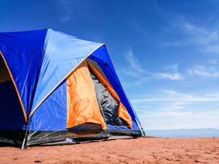 Tent on the mountain with blue sky. Camping in holiday