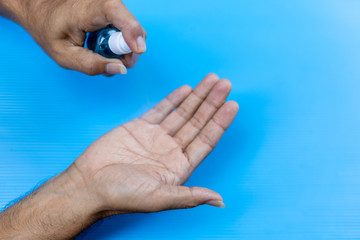 Man applying hand sanitizer for protecting hands from virus disease ,Personal hygiene concept.